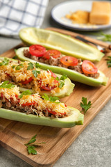 Meat stuffed zucchini boats on board