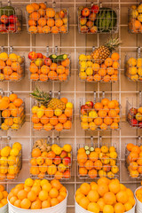 Colourful oranges pinapples and fruit for sale