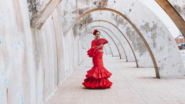 Woman dressed in red dancing flamenco in Malaga