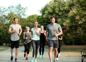 Group of sporty people running outdoors