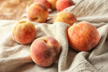 Fresh ripe peaches on table