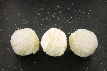 coconut candy on a black background / candy on a black background small depth of field