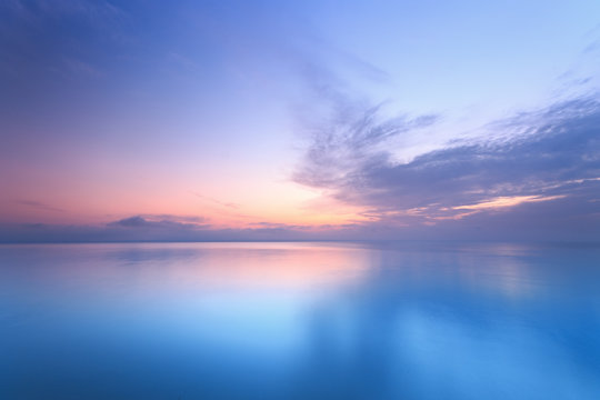 sunrise on the water / Early summer morning bright sky Beach - Powered by Adobe