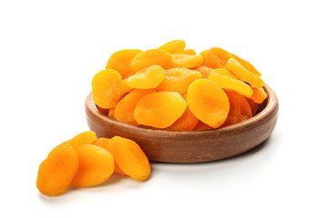 Bowl with dried apricots on white background