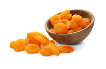 Bowl with dried apricots on white background