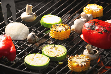 Tasty vegetables cooking on barbecue grill, closeup