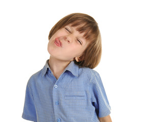 Cute little boy showing tongue on white background