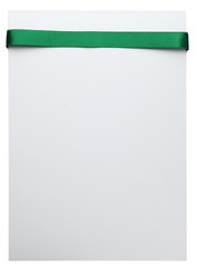 Green satin ribbon on white background