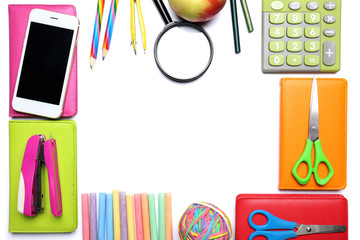 Set of school stationery with mobile phone on white background
