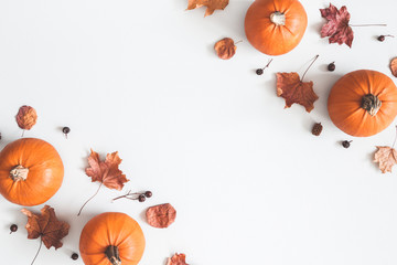Autumn composition. Pumpkins, dried leaves on pastel gray background. Autumn, fall, halloween concept. Flat lay, top view, copy space