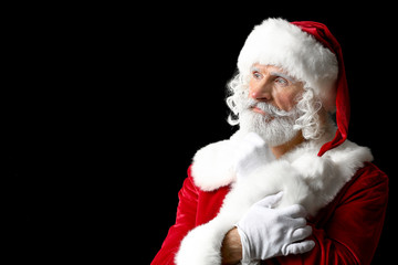 Portrait of Santa Claus on dark background