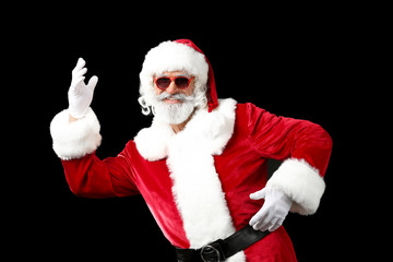 Portrait of cool Santa Claus on dark background