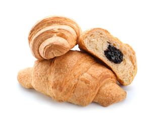 Tasty croissants with jam on white background