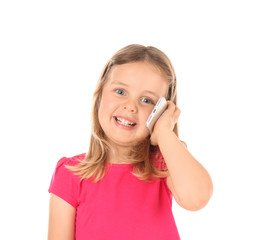 Cute little girl talking on mobile phone against white background