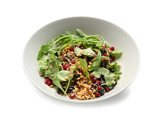 Bowl with healthy fresh salad on white background