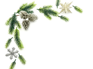 Christmas composition with fir branches and festive decorations on white background