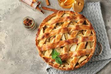 Delicious apple pie on grey table