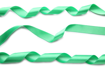 Green ribbons on white background