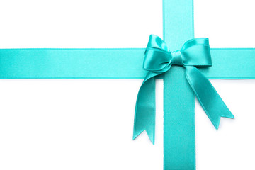 Turquoise ribbons with bow on white background