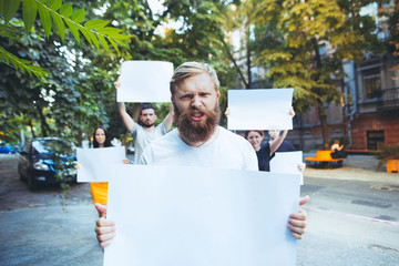 Group of protesting young people outdoors. The protest, people, demonstration, democracy, fight,...