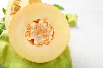 Half of ripe melon on white table