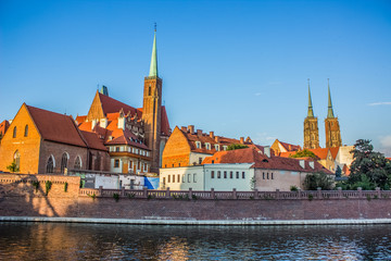 Fototapeta na wymiar old city street panorama near river shore line in colorful summer bright day time