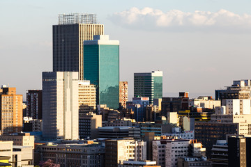 Fototapeta premium Buildings in the city of Johannesburg in the late afternoon sun, Gauteng, South Africa