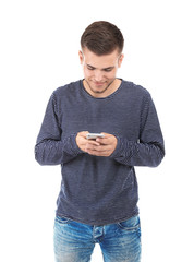 Handsome young man with mobile phone on white background