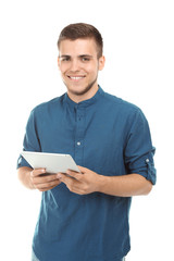 Handsome young man with tablet PC on white background