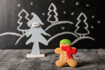 Christmas composition with gingerbread cookie on grey table