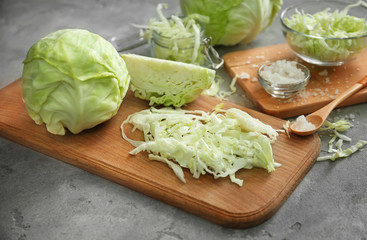Boards with cut cabbage on light table