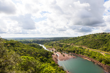 Fototapeta premium The view of the Phongolo river seen from on the dam wall of the pongolapoort dam KZN, South Africa