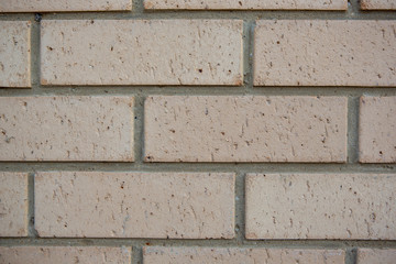 A newly built cream brick wall close up as a texture in South Australia on 29th August 2018