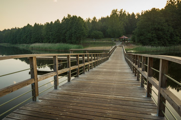 Obraz premium Bridge on the Wydminskie lake in Wydminy, Masuria, Poland