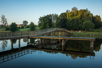 Fototapeta na wymiar Bridge on the Wydminskie lake in Wydminy, Masuria, Poland
