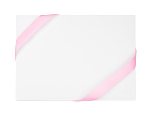 Paper card with pink ribbons on white background