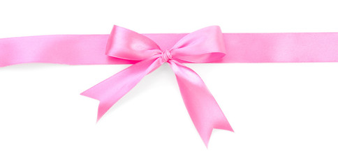 Pink ribbon with bow on white background