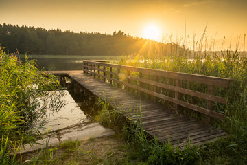 Footbridge on the Wydminskie lake in Wydminy, Masuria, Poland