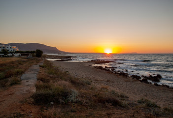 Sunset over Malia on Crete island in Greece
