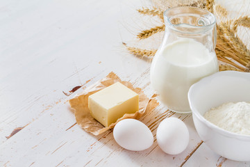 Ingredients for baking - milk, butter, eggs, flour, wheat