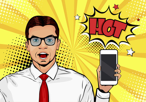 Attractive smiling man with phone in the hand in comic style. Pop art vector illustration in retro comic style. Digital advertisement male model showing the message or new app on cellphone