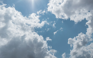 Blue sky background with clouds. White clouds in blue sky