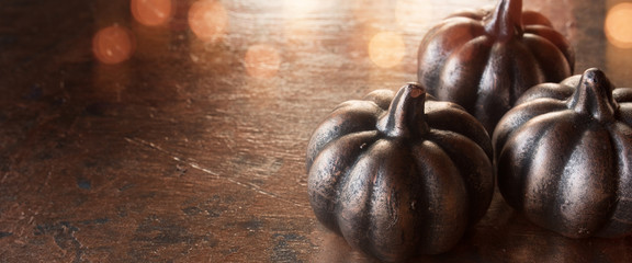 Dark Pumpkins on rusty metallic background