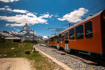 Gornergrat tourist train with Matterhorn mountain in the background. Valais region, Zermatt, Switzerland.