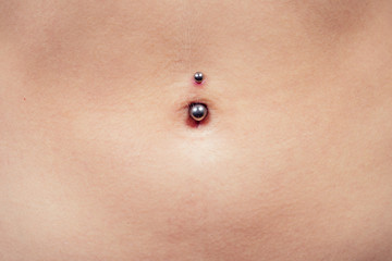 female navel piercing close-up