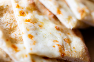 An abstract close up of garlic bread