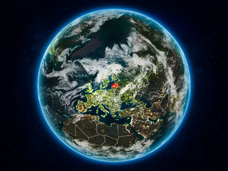 Latvia on Earth at night