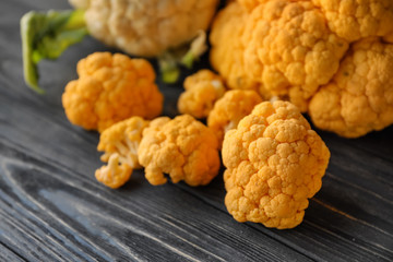 Yellow cauliflower on wooden table