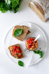 Rye bread toasts and glass jar with eggplant caviar. Vegetable appetizer or antipasti. Healthy food concept