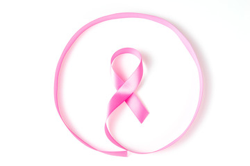 Pink ribbon breast cancer awareness in circle over white background with copy space for text, logo,...
